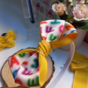 TIARA LETRAS (AMARELO)